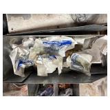 Electric and plumbing parts: Halex EMT Compression Connectors; Cushioned clamps; insulated tap