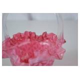 Pink Fenton opalescent glass basket with clear handle, ruffled rim, floral pattern