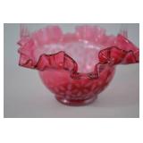 Pink Fenton opalescent glass basket with clear handle, ruffled rim, floral pattern