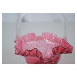 Pink Fenton opalescent glass basket with clear handle, ruffled rim, floral pattern