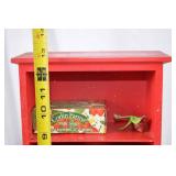 Vintage Red Painted Shelf with Strawberry-Themed Tins and Soap