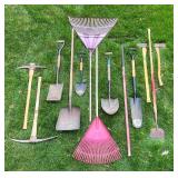 Collection of Garden and Lawn Tools Including Shovels, Rakes, and Axes