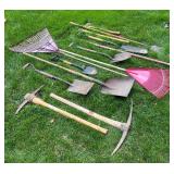 Collection of Garden and Lawn Tools Including Shovels, Rakes, and Axes