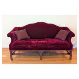 LR - Vintage Burgundy Velvet Sofa with Carved Wood Base and 2 Patterned Pillows