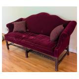 LR - Vintage Burgundy Velvet Sofa with Carved Wood Base and 2 Patterned Pillows