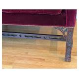 LR - Vintage Burgundy Velvet Sofa with Carved Wood Base and 2 Patterned Pillows