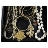 Assorted Costume Jewelry Collection with Necklaces, Bangles, and Brooches