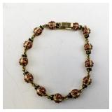 7.5in Gold Tone Base Metal Ladybug Link Bracelet