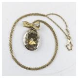 Gold Tone Base Metal Locket Necklace with Bow Accent