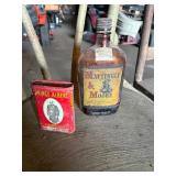 Whisky bottle and Tobacco can