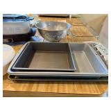Vintage Kitchenware Lot with Slow Cooker, Baking Pans, Colander, and More