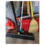 Garage Utility Lot with Trash Cans, Shovels, Brooms, and Containers