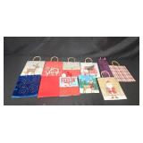 Large Assortment of Christmas Gift Bags, Cards, and Tissue Paper in Storage Bin