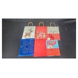 Large Assortment of Christmas Gift Bags, Cards, and Tissue Paper in Storage Bin
