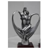 Set of three modern romantic silver-tone resin sculptures