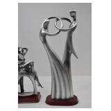 Set of three modern romantic silver-tone resin sculptures
