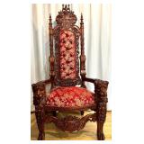 Ornate Antique Carved Throne Chair with Red Floral Upholstery and Lion Head Arms