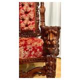 Ornate Antique Carved Throne Chair with Red Floral Upholstery and Lion Head Arms