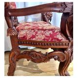 Ornate Antique Carved Throne Chair with Red Floral Upholstery and Lion Head Arms