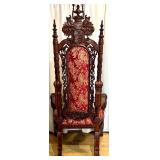Ornate Antique Carved Throne Chair with Red Floral Upholstery and Lion Head Arms