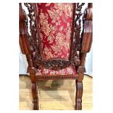 Ornate Antique Carved Throne Chair with Red Floral Upholstery and Lion Head Arms