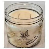 LR - Decorative Candle Holder, Vanilla Breve Scented Candle, and Glass Oil Lamp with Floral Foliage Display