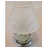 LR - Decorative Candle Holder, Vanilla Breve Scented Candle, and Glass Oil Lamp with Floral Foliage Display