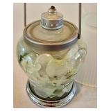 LR - Decorative Candle Holder, Vanilla Breve Scented Candle, and Glass Oil Lamp with Floral Foliage Display