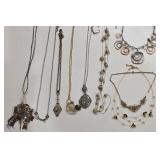K - Assorted Necklace Lot with Mixed Metals, Charms, and Decorative Accents