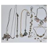 K - Assorted Necklace Lot with Mixed Metals, Charms, and Decorative Accents