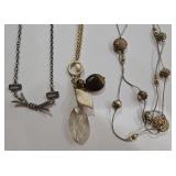 K - Assorted Necklace Lot with Mixed Metals, Charms, and Decorative Accents