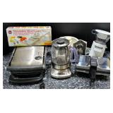 K - Lot of Small Kitchen Appliances and Mandoline Slicer including Breville Tea Maker, Grills, and Food Processor Attachments