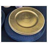 O - Assorted Home Decor Lot with 8 Gold Chargers, 16 Blue Placemats, Gold Metal Planter, and Candles