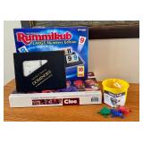 Board Game Lot with Rummikub, Clue, Double Twelve Dominoes, and Jumping Frogs