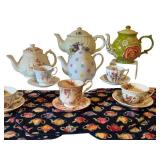 Collection of 3 English Teapots, 4 Bone China Cup and Saucer Sets, and 5 Teapot Print Placemats