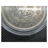 1884 O AU+ Morgan Dollar. Original Surfaces, Sigma Verified .90 Fine Pre 1900
