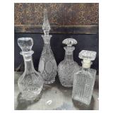 Four Glass/Crystal Decanters w/Lids