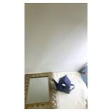 Decorative Wall Mirror with Ornate Frame and Blue Teapot-Shaped Birdhouse