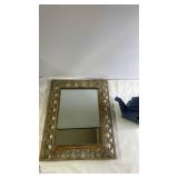 Decorative Wall Mirror with Ornate Frame and Blue Teapot-Shaped Birdhouse