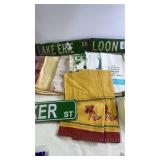 Group of Vintage Kitchen Towels, Decorative Street Signs, and Rotary Wall Clock