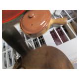 Vintage clay pans, wood bowls and o...