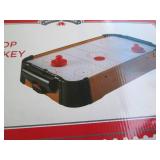 Tabletop air hockey game in origina...