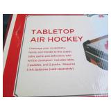 Tabletop air hockey game in origina...
