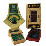 Set of 4 Vintage Handheld Electronic Games including Armor Battle, Electronic Quarterback, Head to Head Baseball and Hockey