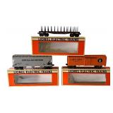 Lionel O Gauge Train Cars including Norfolk & Western Hopper, New York Central Flat Car with Stakes and Illinois Central Box Car