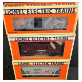 Three Lionel Electric Train Cars including Lionel Model 6-16264 Red Wing Shoes Box Car