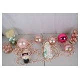 Collection of Pink and Pastel Christmas Ornaments and Santa Figurines
