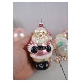 Collection of Pink and Pastel Christmas Ornaments and Santa Figurines