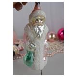Collection of Pink and Pastel Christmas Ornaments and Santa Figurines