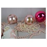 Collection of Pink and Pastel Christmas Ornaments and Santa Figurines